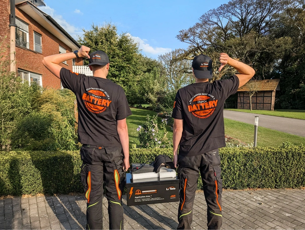 Two LiTime representatives wearing branded shirts during an outdoor community activity